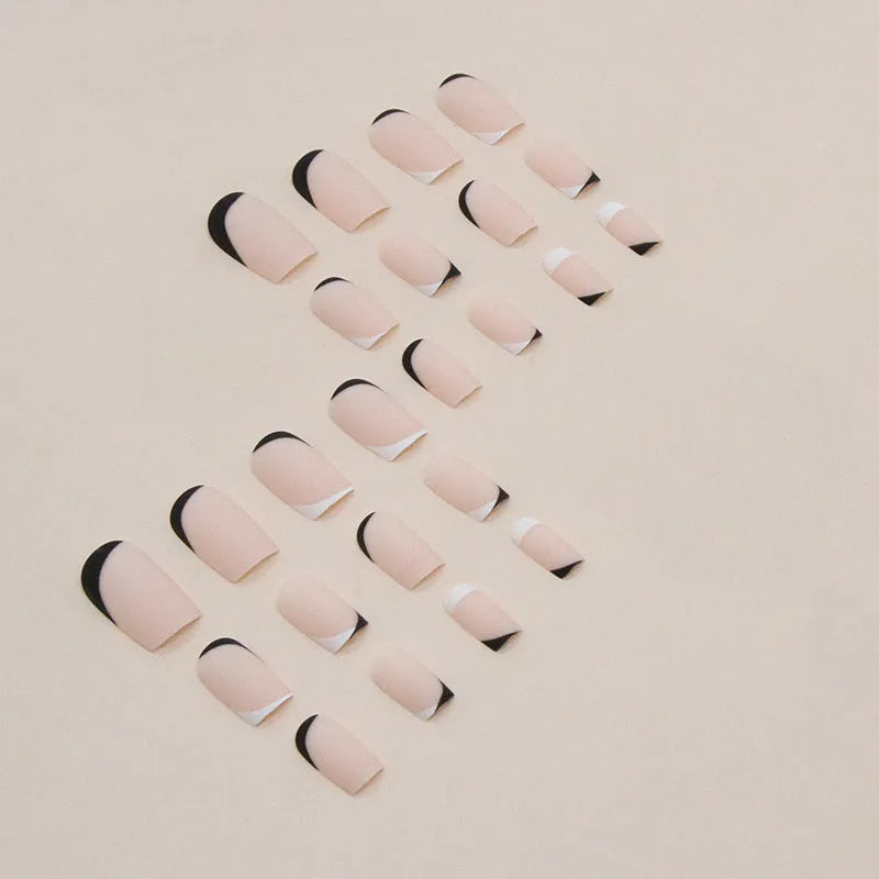 W644 black and white frosted matte press-on false nails set on a hand