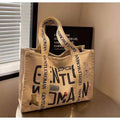 Large canvas women's travel tote bag with print design options including black letters and patterns.
