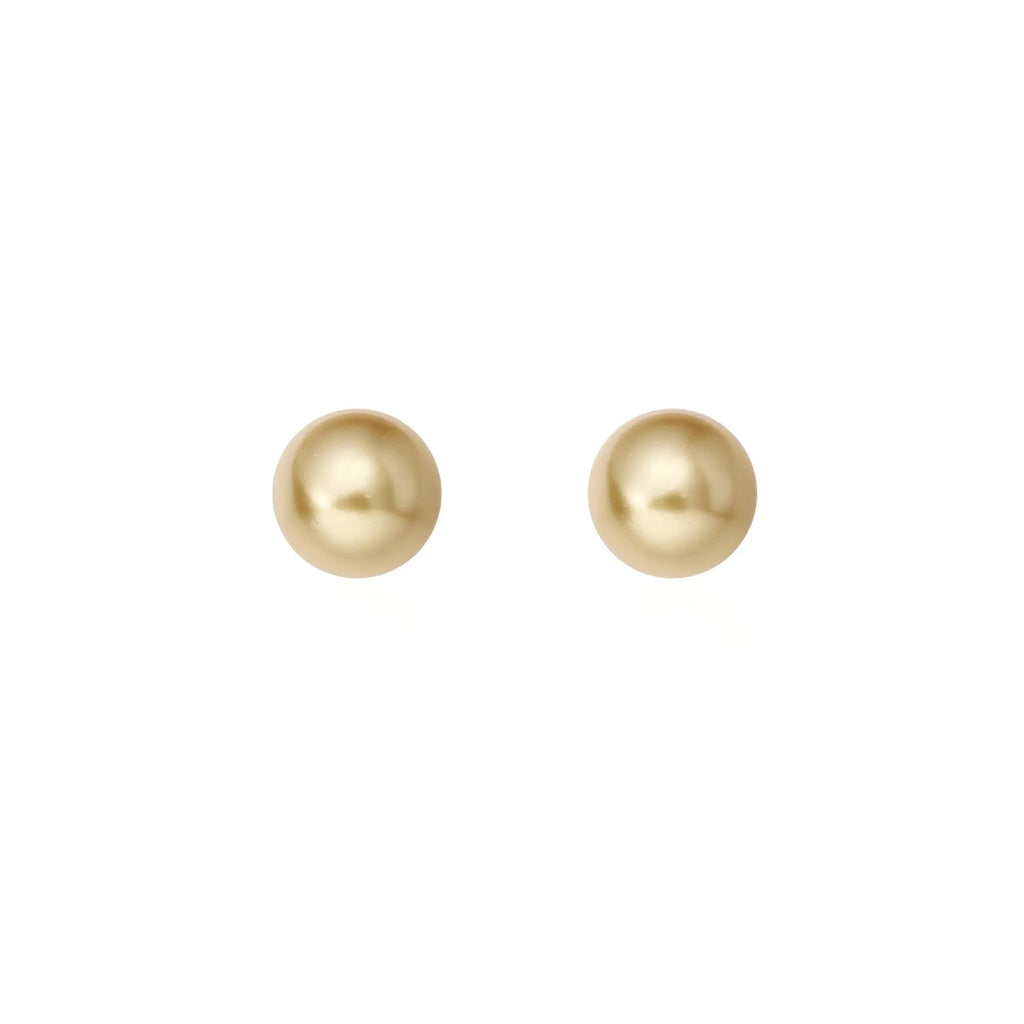 Geometric pearl stud earrings with an eight-point star setting, shown in silver.