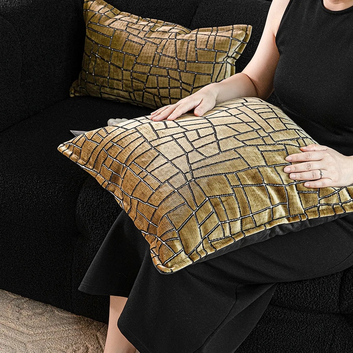 Gold geometric pattern decorative cushion cover shown in square and waist pillow sizes on a grey sofa.