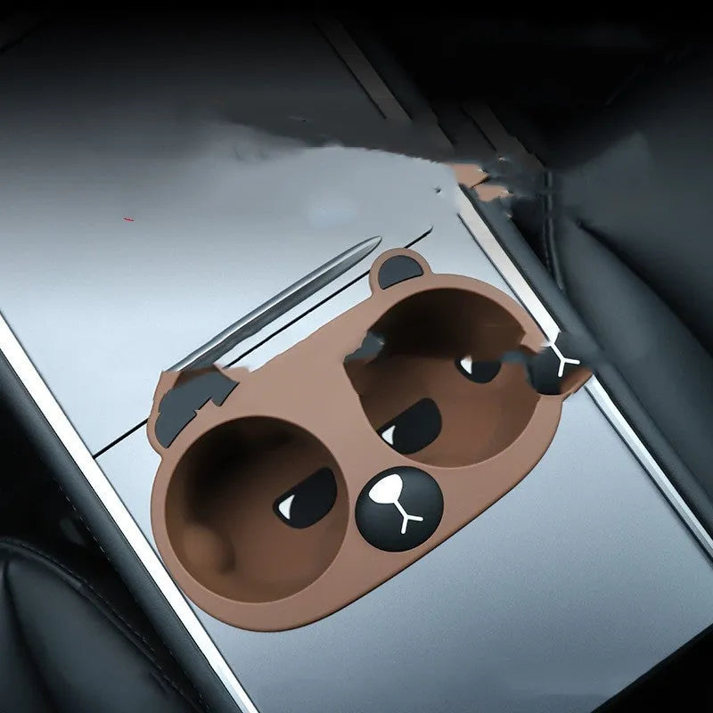 Grey silicone anti-slip insert for a car centre console cup holder.