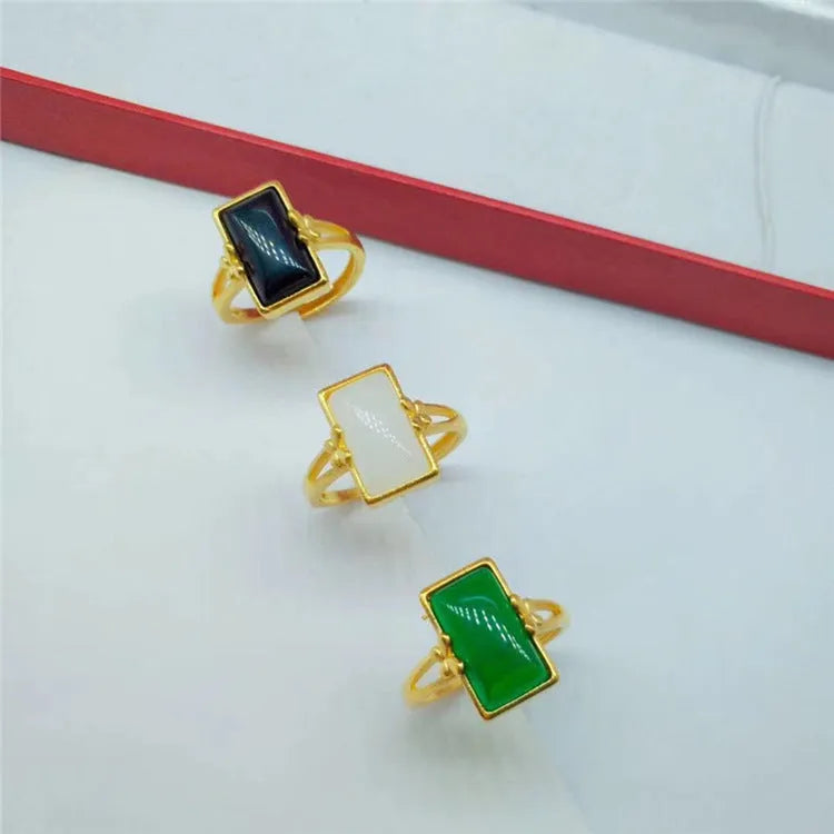 Adjustable brass gold-plated ring with artificial gemstones in black, green and white colour options