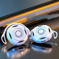 Black wireless Bluetooth gaming earphones with hanging ear design and USB charging cable