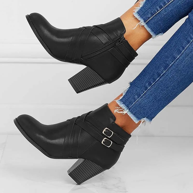 Plus size black short boots with a side zipper, buckle, and a 7cm stout heel on a rubber sole.