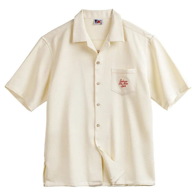Light apricot men's shirt with a bamboo and floral pattern and a Cuban collar.