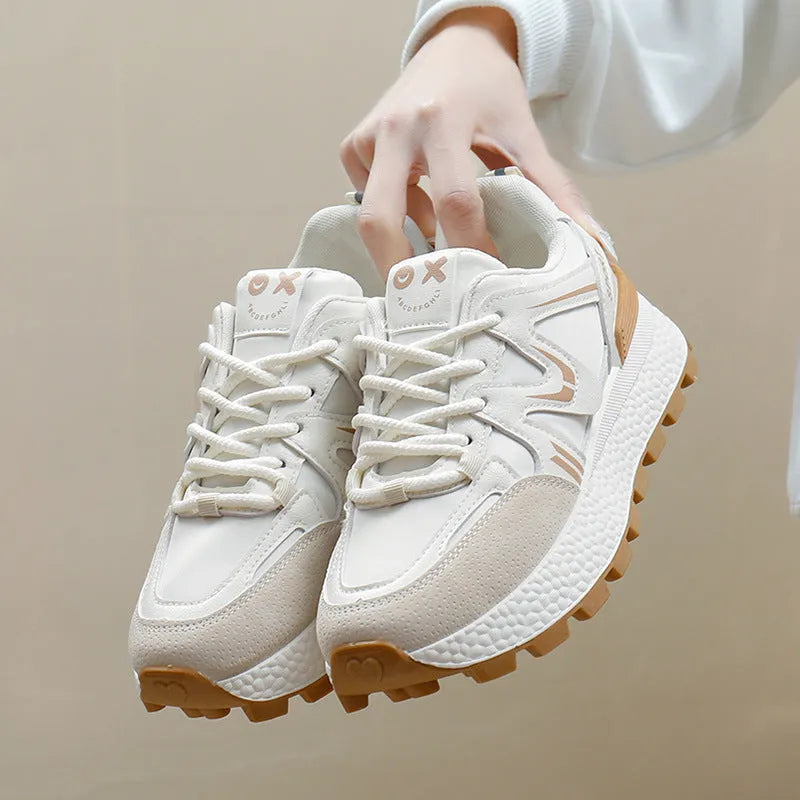 Women's black lace-up platform casual sports shoes with round toe and flat heel.