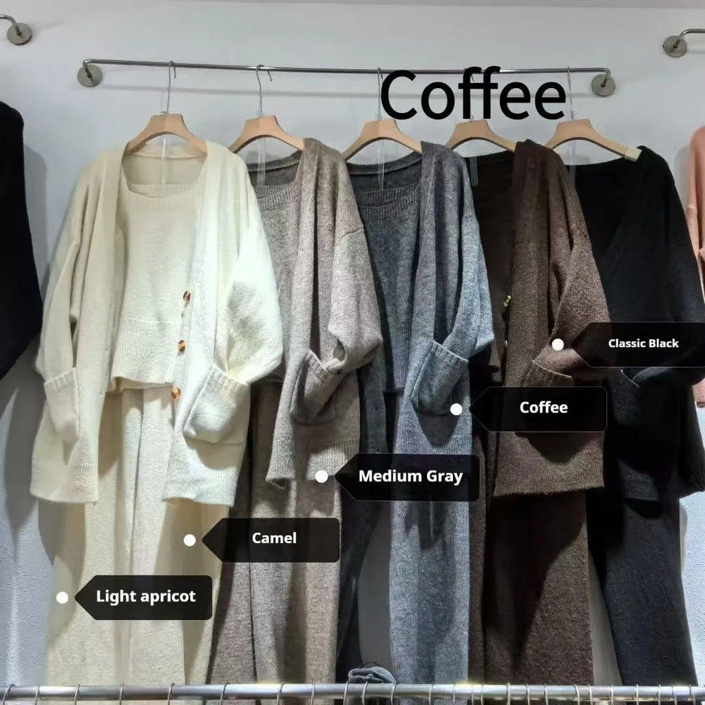 Women's beige knitted cardigan three-piece set with sleeveless vest and suspender trousers on a hanger.