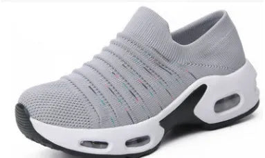 Women's plus size fly-knit socks shoes in dark blue with mesh upper and low heel, showing round toe design.