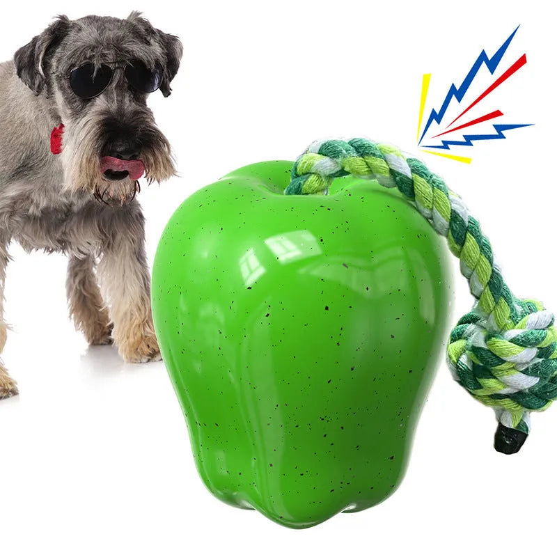Green plastic dog food dropping ball molar toy with apple design for interactive feeding and chewing