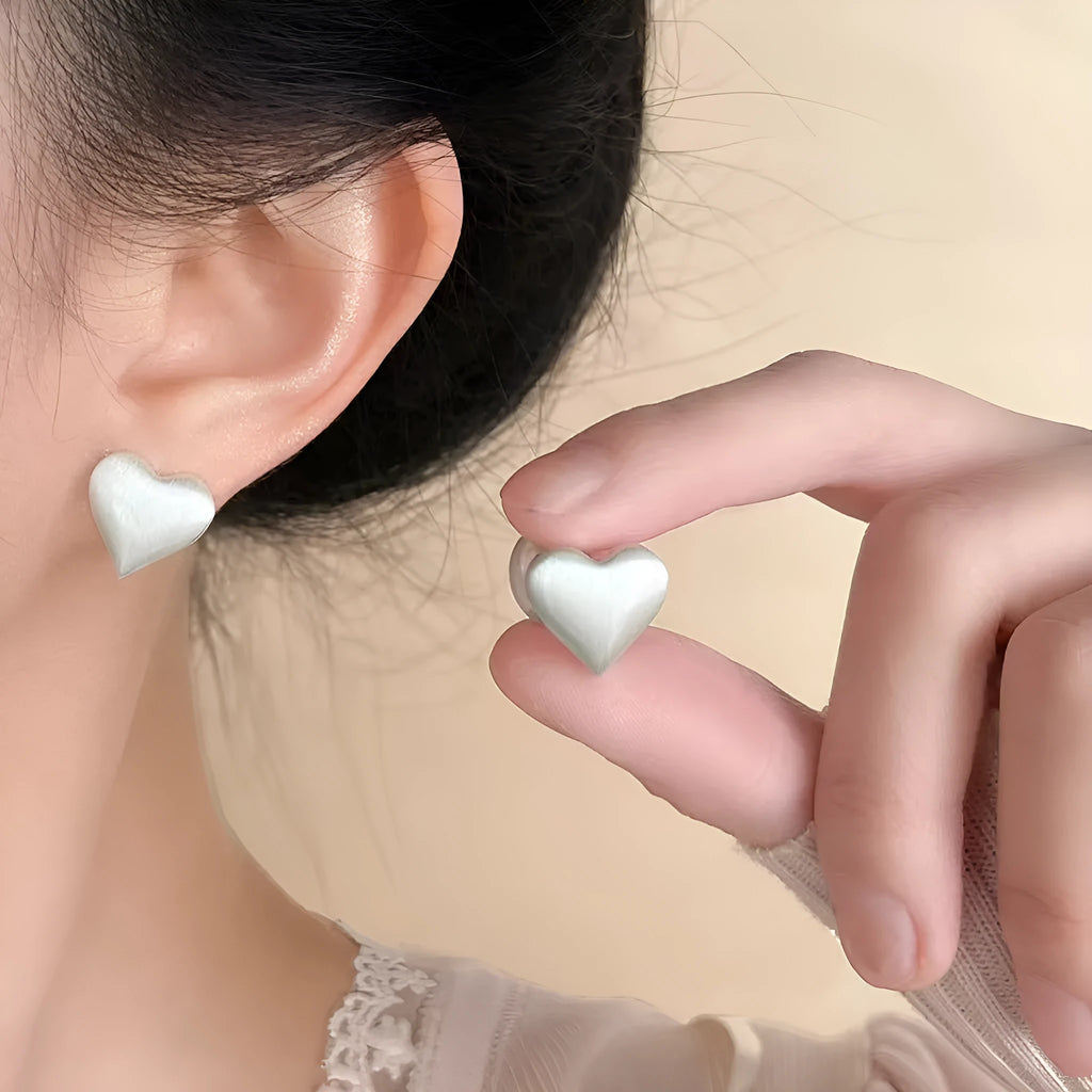 Love Pearl women's white pearl stud earrings with post-back fastening on white background