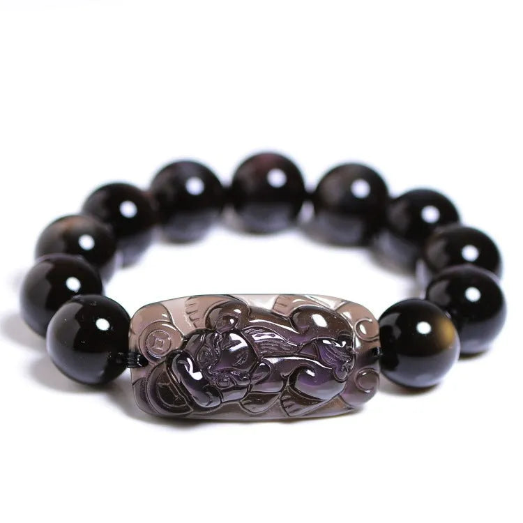 Natural crystal bracelet with a Pi Xiu charm and icy obsidian beads in geometric ethnic style.