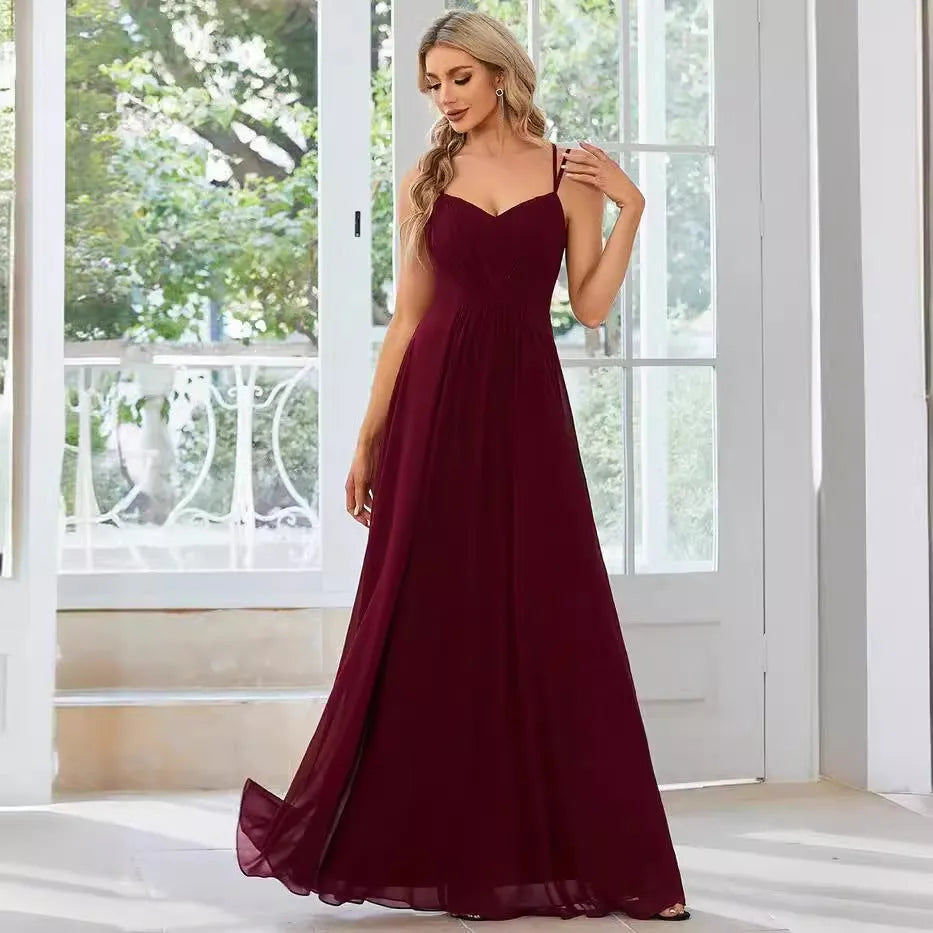 Women's sleeveless pleated A-line long dress in light green, shown in a solid colour with a long skirt.