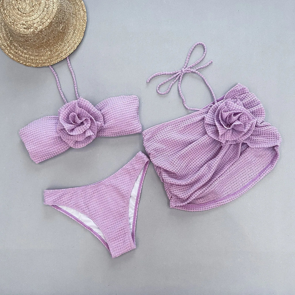 Women's 3D flower split three-piece bikini set in purple or white.