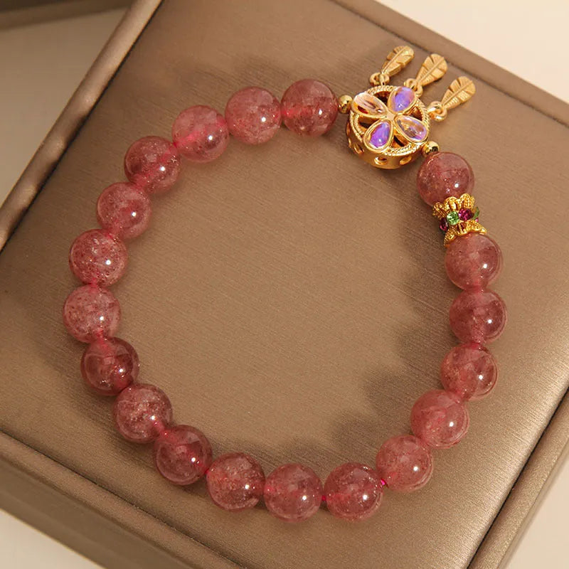 Women's strawberry quartz bracelet with four leaf clover dream catcher crystal pendant