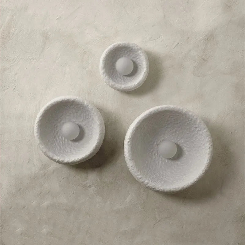 Japanese-style simple silent wall lamp with resin shade in warm white light.