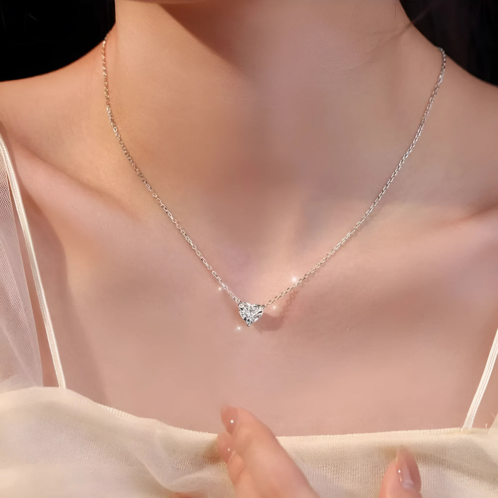 Women's silver heart necklace with copper construction and simple pendant design