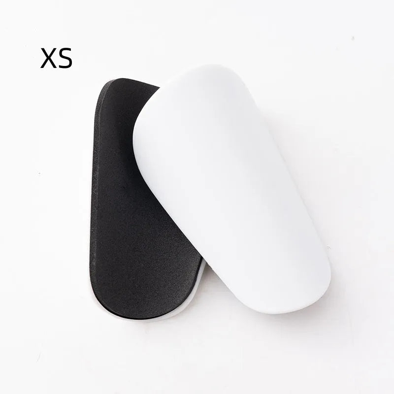 Pair of black PU mini shin guards for sports protection, showing S size.