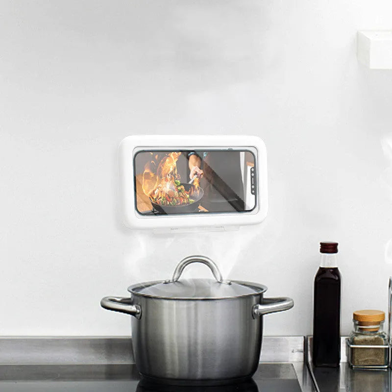 White plastic waterproof phone holder mounted on tile with phone inside, showing touch screen and anti-fog window.