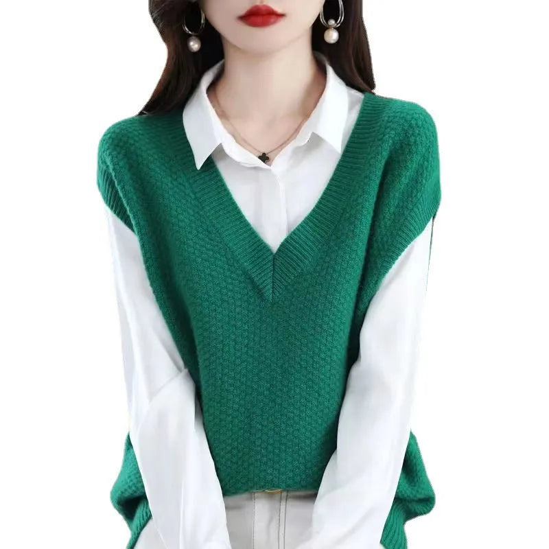 Creamy-white knitted sleeveless vest with 3D pattern and V-neck on a hanger