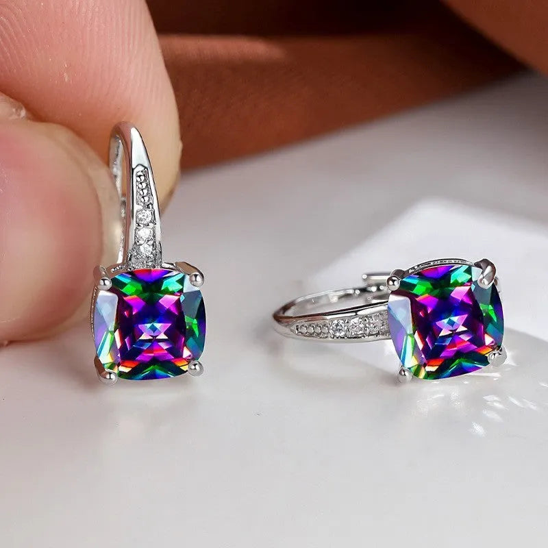 Square geometric ear hook earrings with zircon stones in an electroplated copper setting.