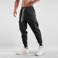Men's loose cotton trousers with ankle tie fastening and multiple pockets in six colour options