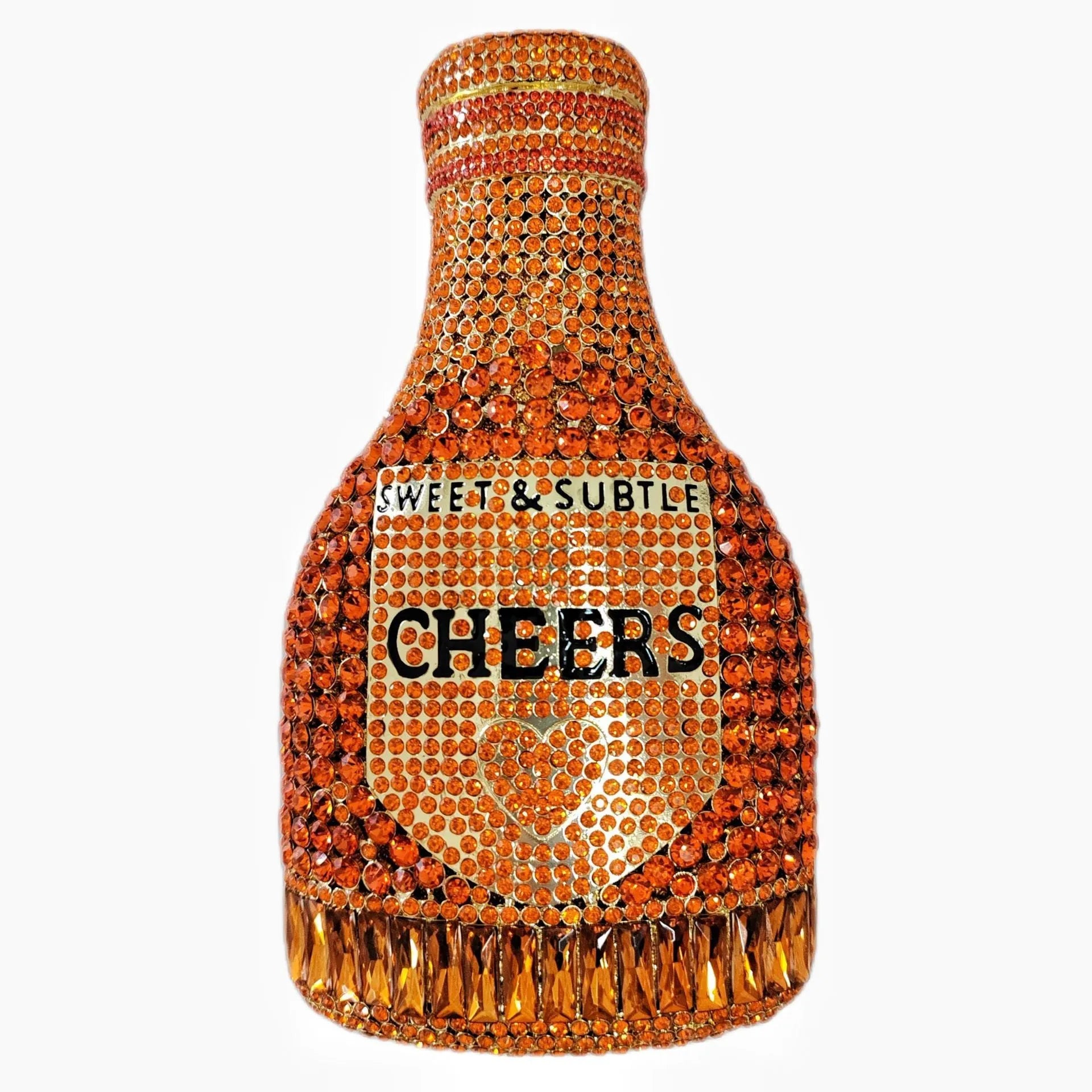 Gold hard-shell champagne bottle shaped evening clutch with rhinestones on a table.