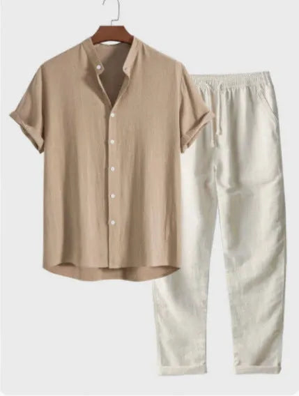Man wearing a loose-fit light-coloured linen short-sleeve shirt and matching casual trousers from a two-piece suit set.