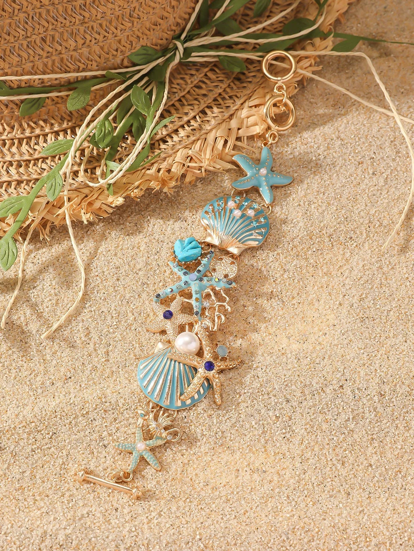 Alloy marine shell boat anchor rhinestone bracelet with starfish details in turquoise colour.
