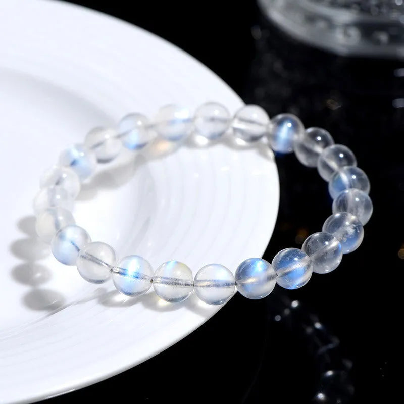 Natural cream blue moonlight crystal bracelet with polished surfaces and simple unisex design