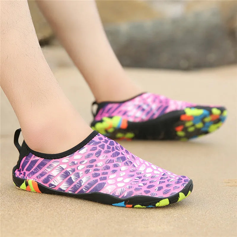 A pair of Lycra beach wading shoes with an EVA midsole, shown in camouflage colour.