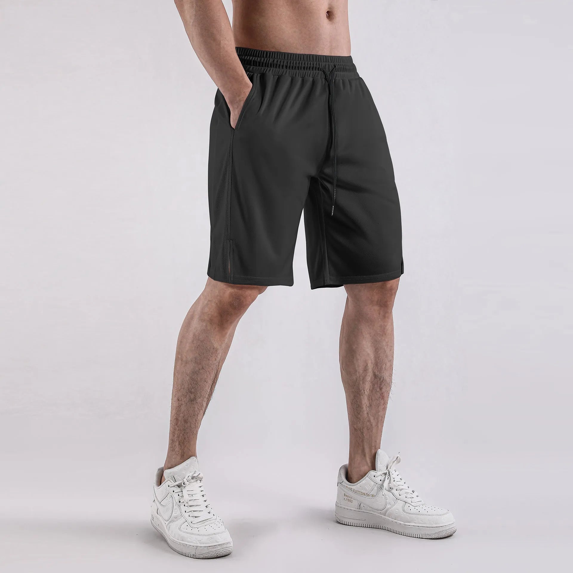 Men's black mesh fitness shorts with quick-drying fabric and mid-waist loose casual design
