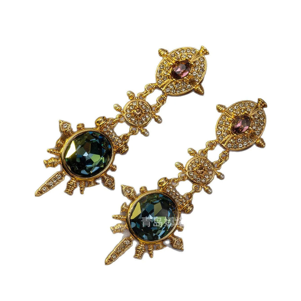 Gold alloy retro geometry stud earrings with round shape and diamond treatment.