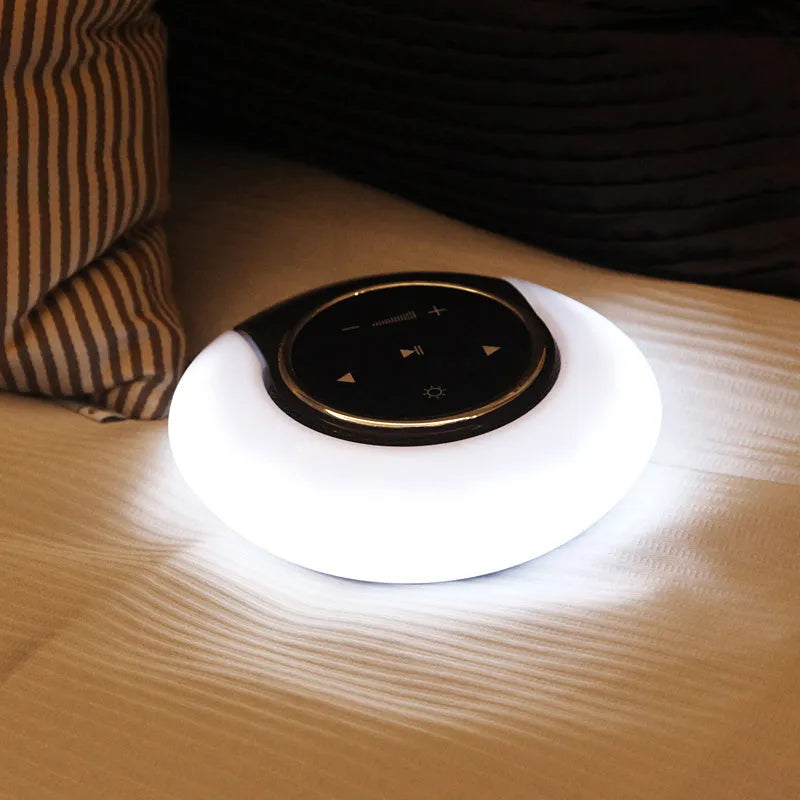 Blue Bluetooth desk lamp speaker with touch controls showing white, yellow, and blue lighting options