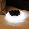 Blue Bluetooth desk lamp speaker with touch controls showing white, yellow, and blue lighting options