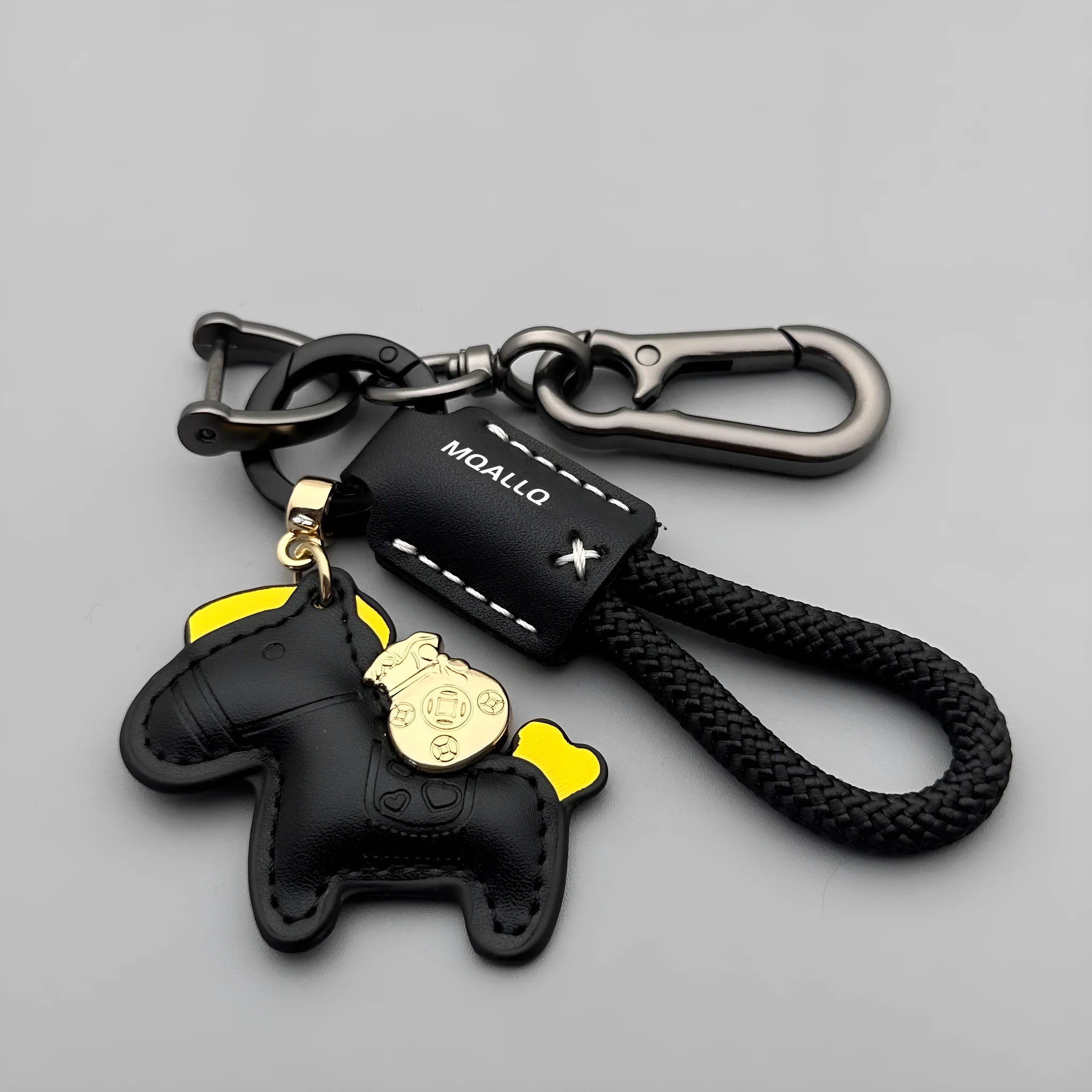 Handmade brown cowhide leather car key ring pendant with a zinc alloy belt buckle and green flanelle rope.