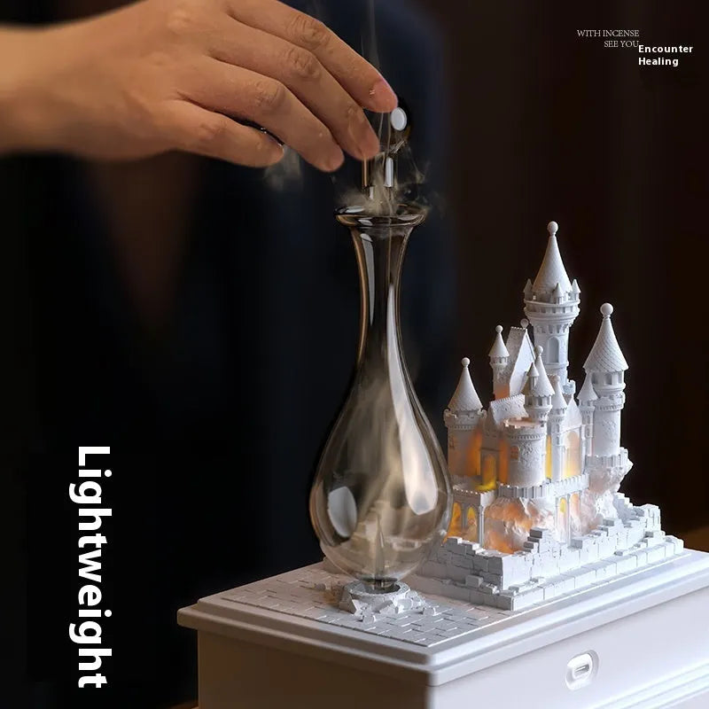 White composite gypsum medieval castle aromatherapy machine with USB charging port on wooden table