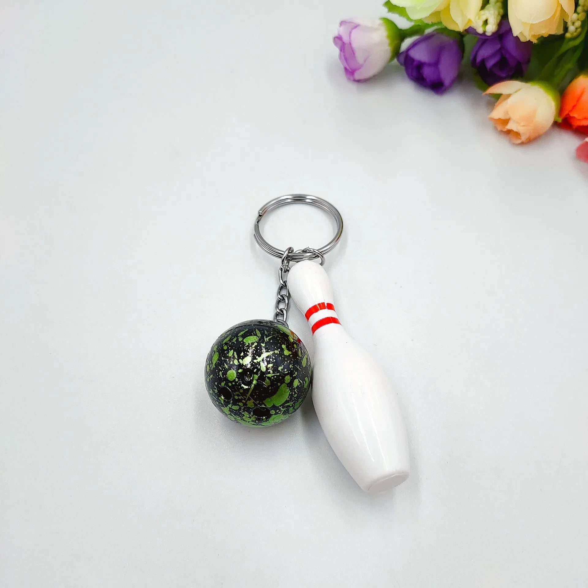 Mini simulation sports bowling keychain pendant in PVC metal on a key ring.