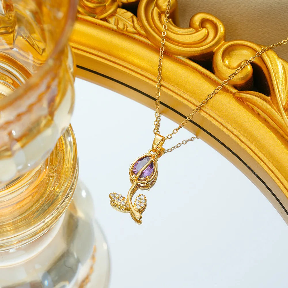 Gold zircon tulip flower pendant necklace on an adjustable titanium steel chain.