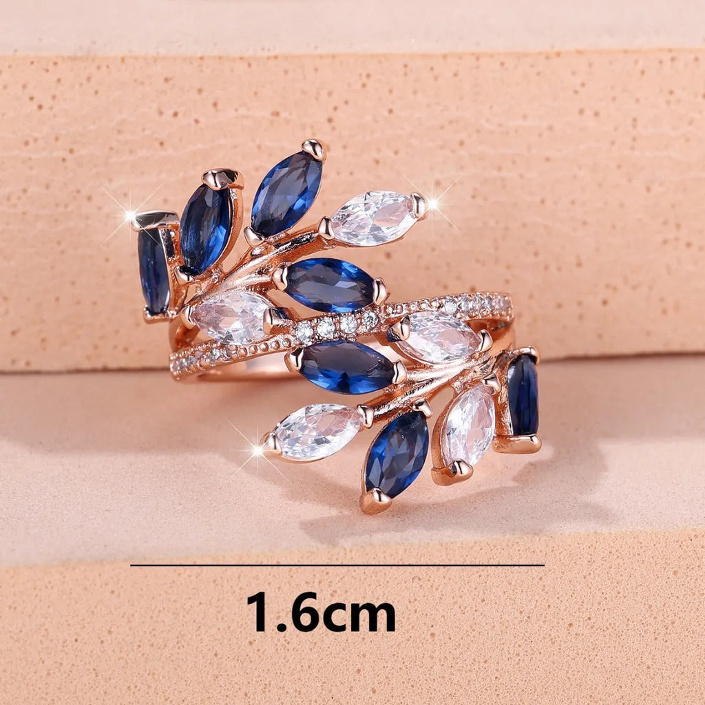 Adjustable copper leaf ring with horse eye zircon accents in multiple colour variations