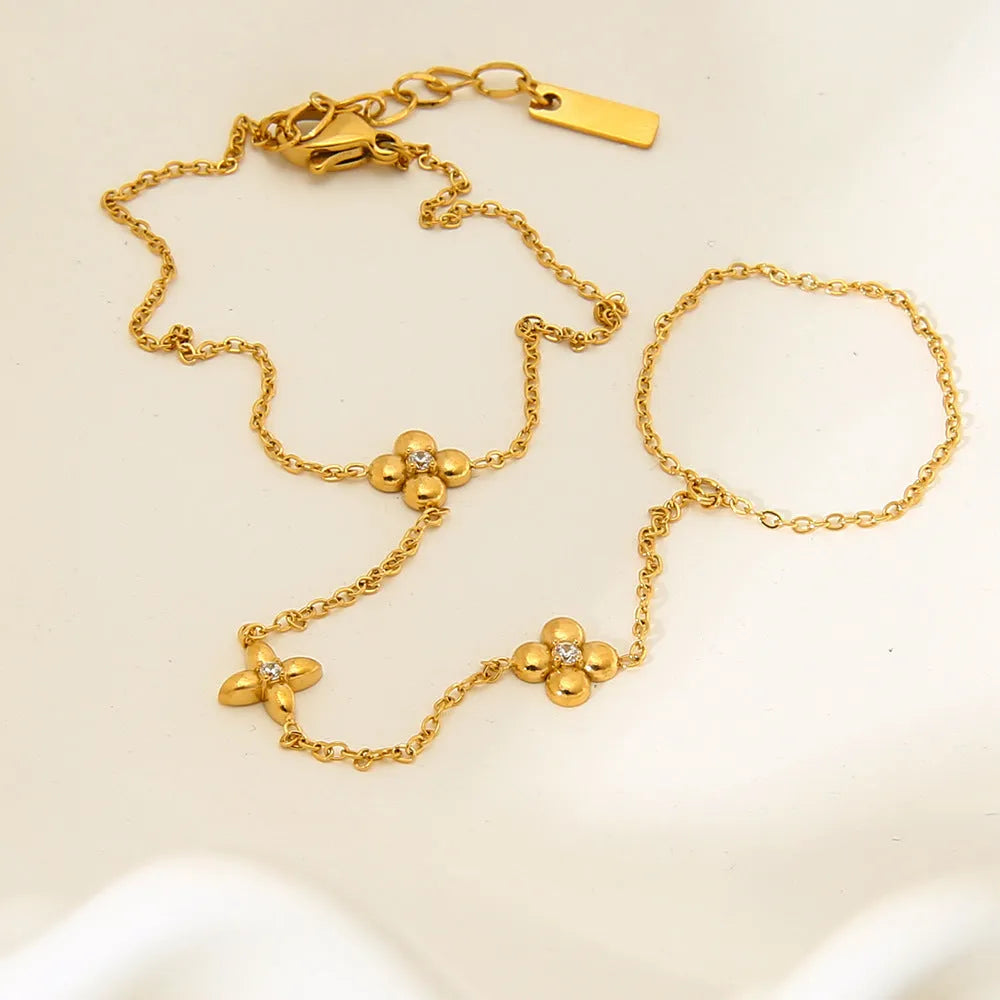 Gold stainless steel women's bracelet with eight-pointed star and floral geometric design