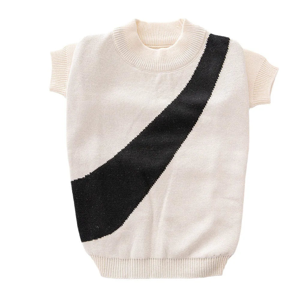 Wool knit dog sweater for corgis and poodles in assorted colours and sizes on a mannequin.
