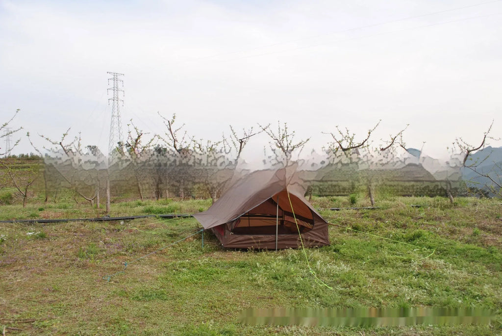 Brown or white A-line cabin tent pitched with trekking poles, showing spacious interior and waterproof fabric construction