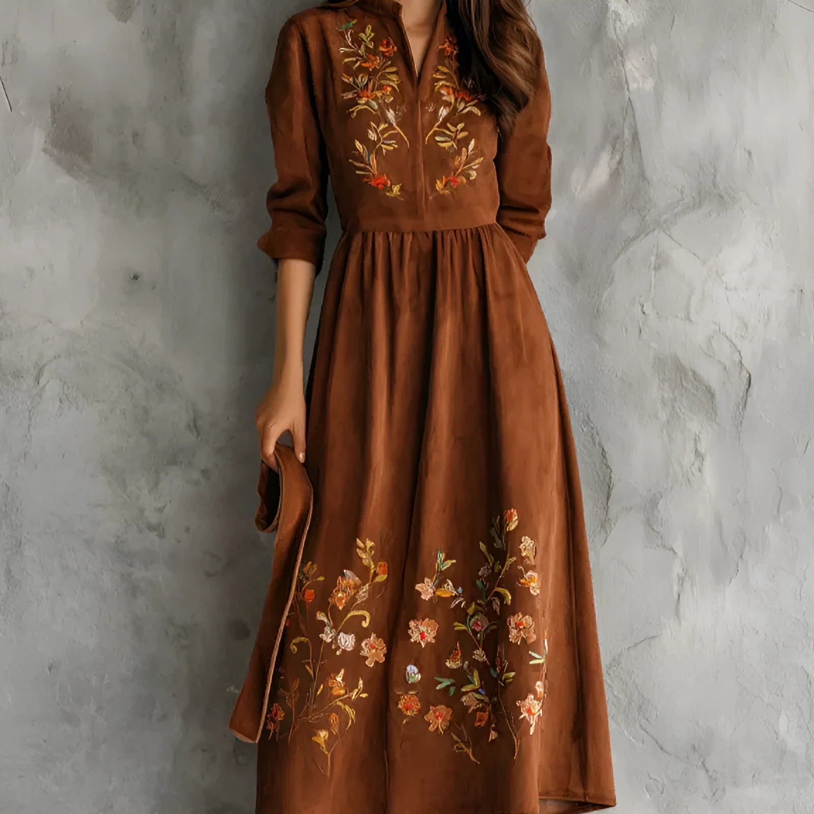 Brown knee-length vintage dress with floral embroidery on suede-like material.
