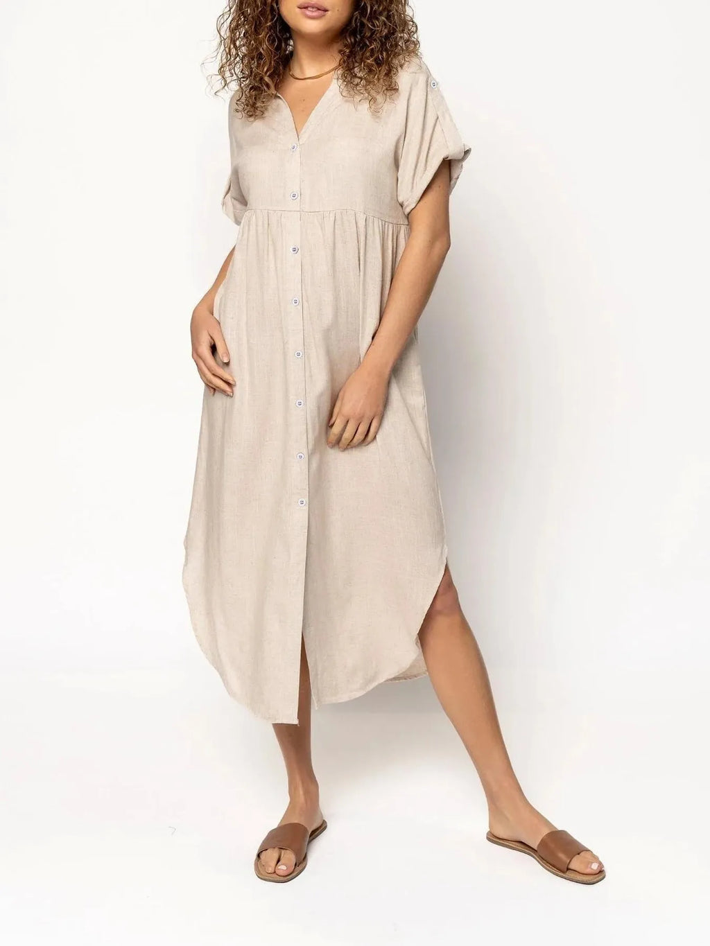 A mid-length casual dress with button detail on the front, shown in a solid colour.