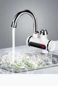 White kitchen instant electric water heater with digital temperature display and tap