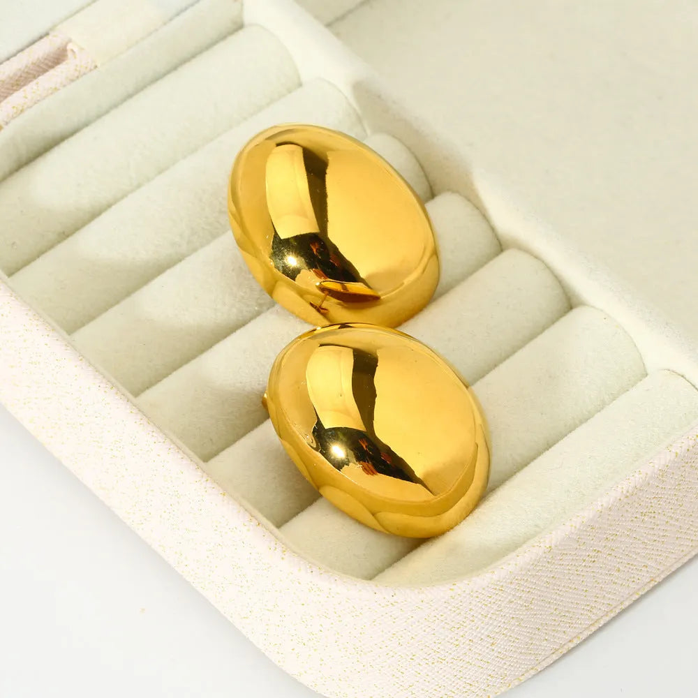 Geometric stainless steel ear studs with a glazed 18K gold electroplated finish and linear design details.