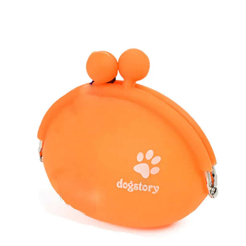 Yellow silicone pouch with hook-and-loop closure for dog treats, shown on a waistband.