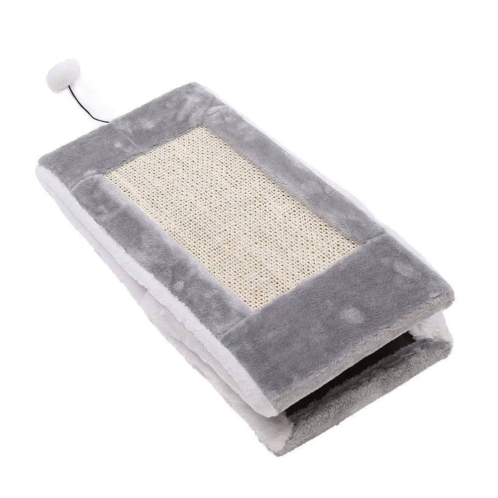 A grey and white triangular cat toy with a sisal scratching side and a soft plush bed.