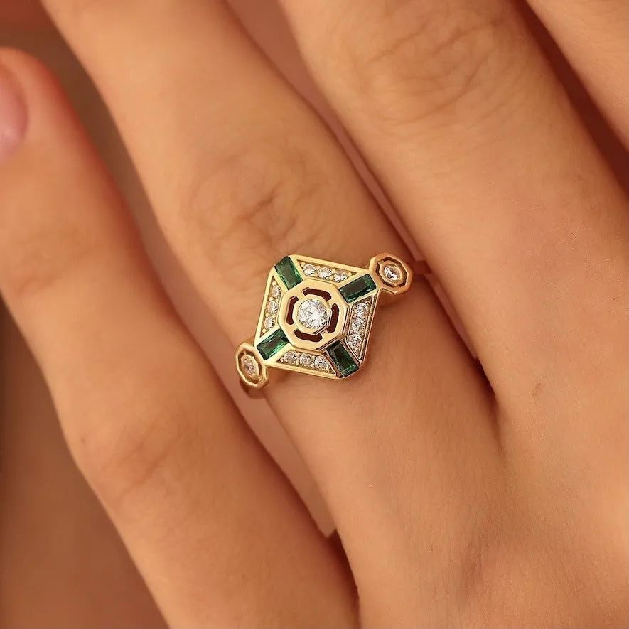 Square geometric emerald diamond fashion ring in lvzuan colour on a white background.