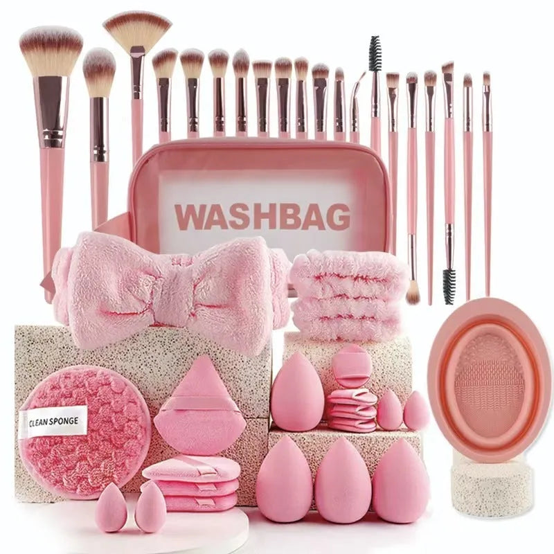 Beauty tool combination set with multiple pieces in pink, brown and purple colours for face wash and makeup application